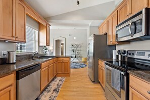 Fully-equipped kitchen with granite counter-top