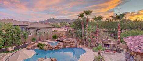 Gaze westward as the sun descends behind the majestic Tonto Mountains. 