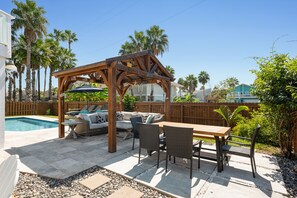 Dinning area, gazebo, large pool, firepit for your enjoyment