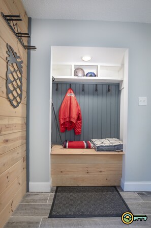 Ski and ski gear storage.  Bench is also a trunk.