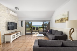 Living room with smart TV and split air