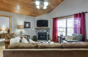 Cozy living room with queen sleeper sofa and fireplace