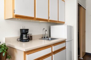 Kitchenette with coffee maker, microwave, and mini-fridge. Perfect for a quick breakfast to enjoy on the porch!
