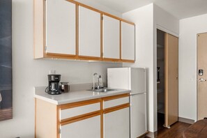 Kitchenette with microwave, mini-fridge, and coffee maker. Perfect for a quick breakfast to enjoy on the patio!