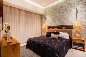 The bedroom features a comfortable king size bed