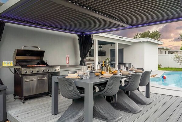 Modern table with a seating for 8 comfortable but could be extended for 4 more people.
BBQ on deck to make fancy meals.