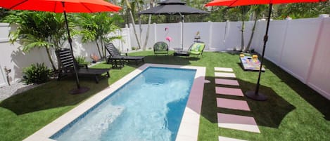 Private pool with plenty of seating and lounge chairs