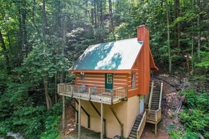 Aerial shot of Higher Ground Retreat surrounded by lush greenery. 