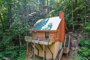 Aerial shot of Higher Ground Retreat surrounded by lush greenery.