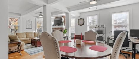 Step into the timeless charm of our historic condo, where the open layout seamlessly blends the dining room, living room, office area, and kitchen into a harmonious space.