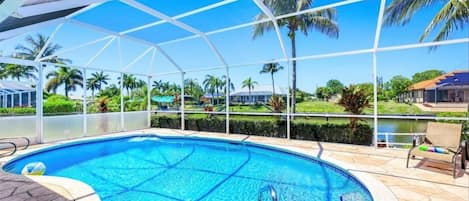 Pool with gulf access canal view