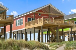 Picture of exterior of home from beach side.