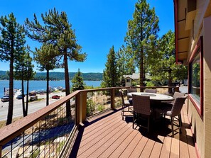 Counter height dining table with fire pit to enjoy meals and the amazing views.