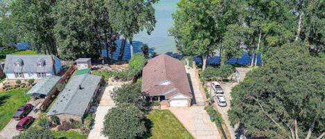 Home sits on a large lot and is waterfront. Driveway can accommodate up to 8 cars!