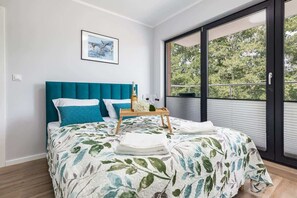 The cosy bedroom features a luxurious double bed.