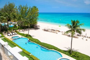 Views of the pool and beachfront from the balcony. 