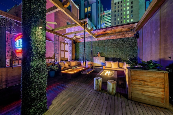 Printers Alley Penthouse large private deck overlooking world famous Printers Alley with fire table, dog grass area and tons of seating 