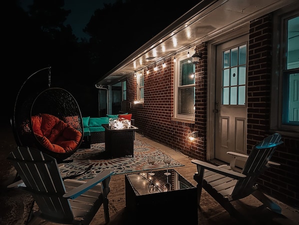 Enjoy the vibes on our outside patio—day or night.
