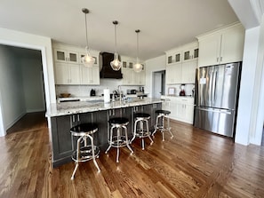 Large, fully stocked kitchen. 