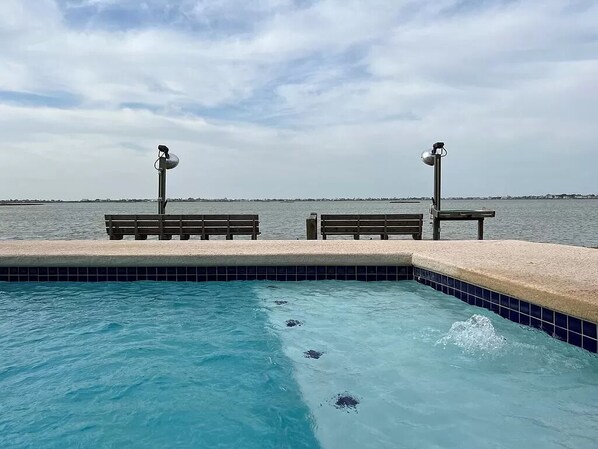 The view you will enjoy from the pool overlooking the deck & Salt Lake.