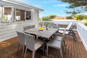 Windows from kitchen fold back for easy serving on deck