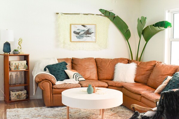 Leather reclining sectional with pull-out-bed in the living room