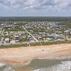Aerial view shows just how close you are—only one block from the beach! Walk to the sand in minutes.