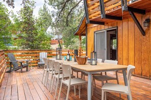 Large outdoor dining area and grill.