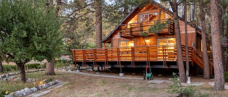 Gorgeous cabin with a large deck and an upper balcony.