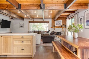 Large indoor dining table with bench seating.