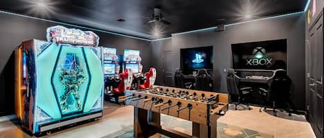 Game Room with with commercial Transformer's & two race car arcade game