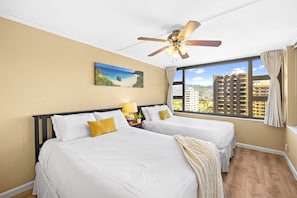 Bedroom with 1 queen-size and 1 full size bed and ceiling fan
