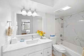 Full bathroom with tub and shower combo