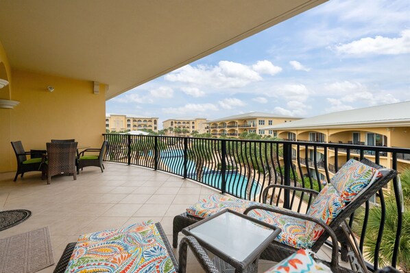 Overlook the pool on our oversized balcony