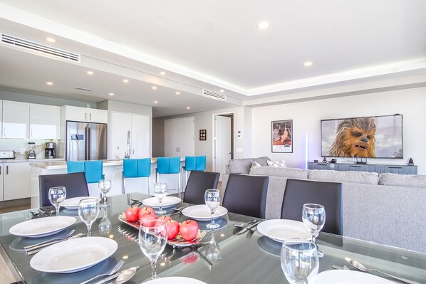 Dine at the opulent glass dining table for six.