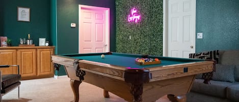 Gorgeous game lounge equipped with pool table and ping pong table