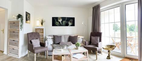 spacious, bright living area with access to the balcony