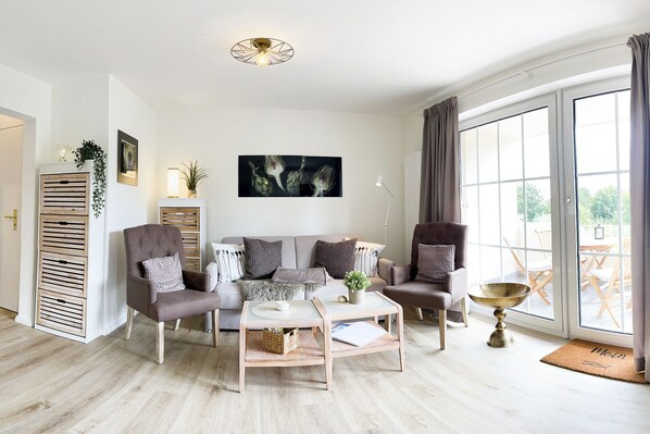 spacious, bright living area with access to the balcony