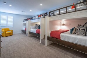 This AWESOME bunk room is the perfect kid's zone!