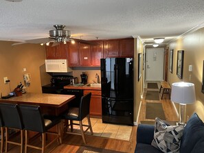 Kitchen including dishwasher, toaster, coffee maker (12 cup pot), and ice maker.