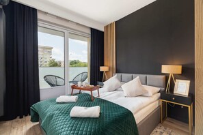 The cosy bedroom features a luxurious double bed and ample storage.