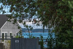 Peek-a-boo water views and a public beach just a 4 minute walk from the cottae.