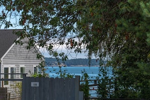 Peek-a-boo water views and a public beach just a 4 minute walk from the cottae.