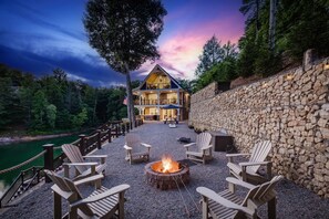 Skipping Stones Getaway Backyard with hot tub, fire pit, wood, roasting forks, corn hole boards, picnic table