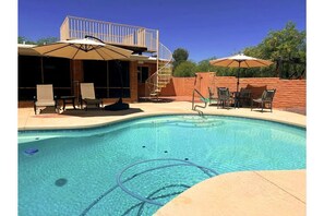Backyard pool area with plenty of shade