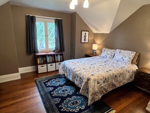 Third bedroom upstairs with queen bed and a closet. 
