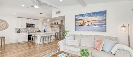 Open floor plan with airy coastal decor so the inside matches the outside.