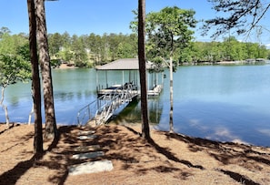 Flat stone path to enormous oversized deep water (10-12ft) dock on calm cove