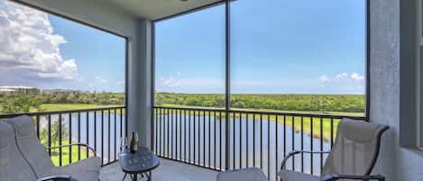 Enjoy beautiful sunsets from this gorgeous third-floor condo overlooking the protected wetlands leading out to the Gulf
Overlooks Hole 11 on the golf course.