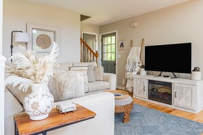 Comfy living room with smart TV and electric fireplace